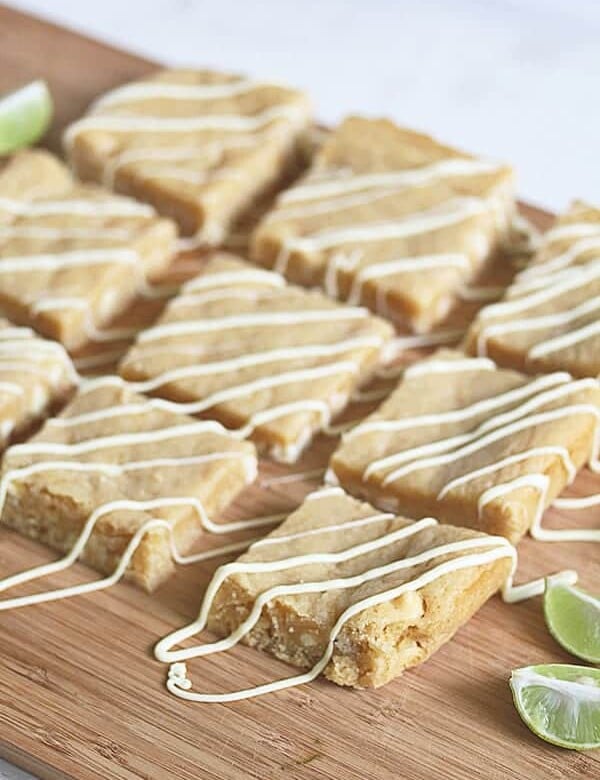rows of key lime white chocolate blondies on wood board