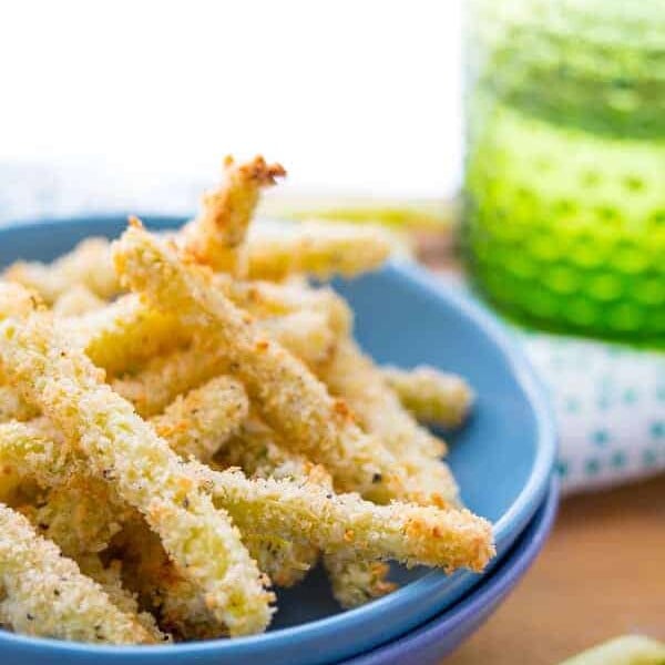 crispy parmesan baked green bean fries in blue bowl