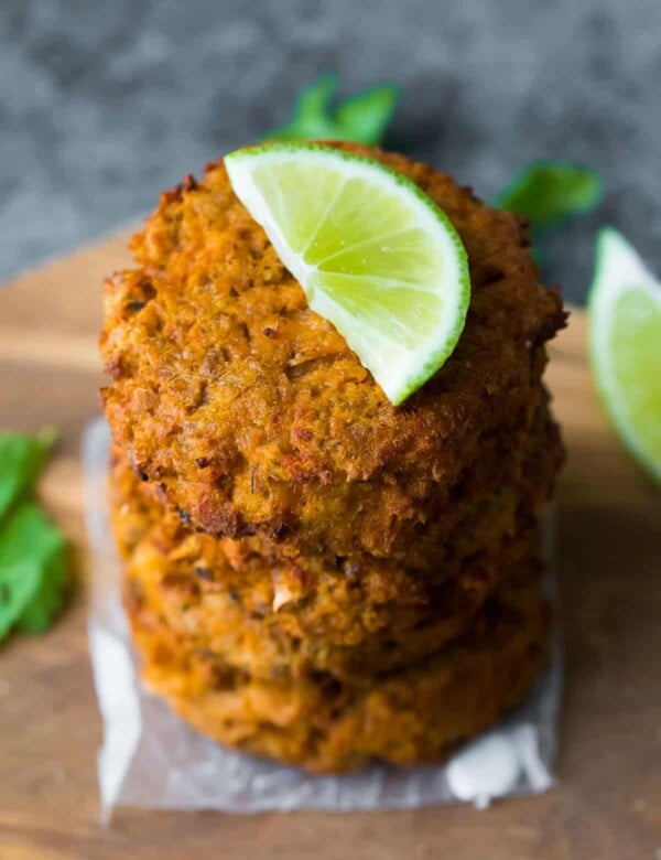 stack of thai salmon patties with lime wedge on top