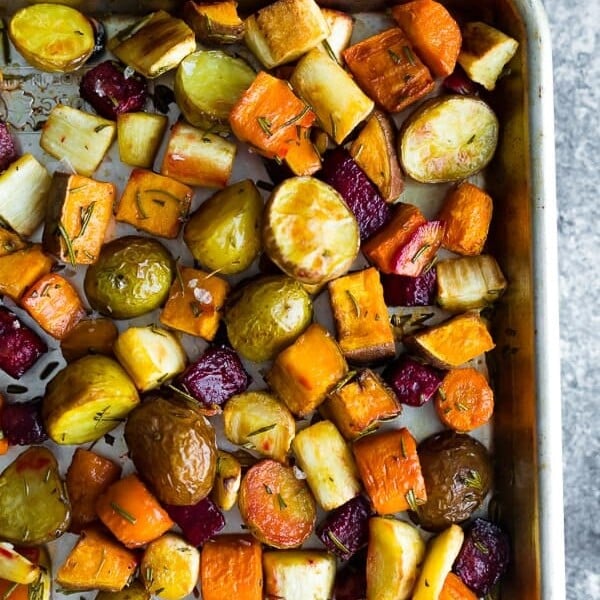 overhead shot of rosemary root vegetables on sheet pan